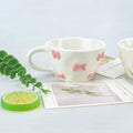 1pcs Irregular hand drawn underglaze color relief blue daisy pink bow ceramic mug water cup